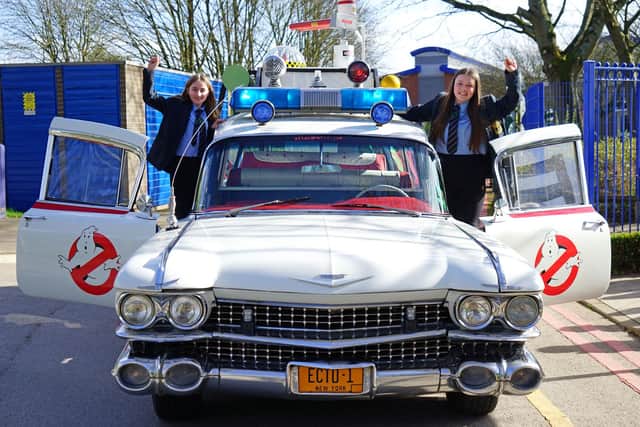 Competition winner Gemma Alexander and her friend Olivia Dean were collected from National Academy by the Ghostbusters Ecto-1 car. Photo: Brian Eyre