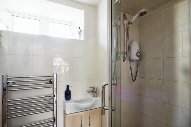 There are shower rooms on both the first floor and second floor of the grade II listed building. Here is one of them, with shower enclosure, wash hand basin and heated towel-rail.
