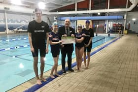 Coun John Wilmott presents a cheque for £500 to Hucknall Falcons Swimming Club
