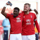 Joe Worrall (right) and team-mate Serge Aurier celebrate Nottingham Forest's 1-0 win over Arsenal which secured the Reds' Premier League survival. Photo: Getty Images
