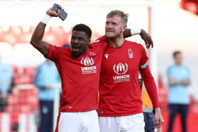 Joe Worrall (right) and team-mate Serge Aurier celebrate Nottingham Forest's 1-0 win over Arsenal which secured the Reds' Premier League survival. Photo: Getty Images