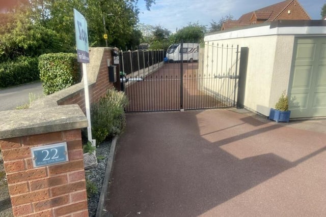 Offering lots of off-street parking space, including for a caravan or motorhome, at the £415,000 property is a long, gated driveway and an integral garage.