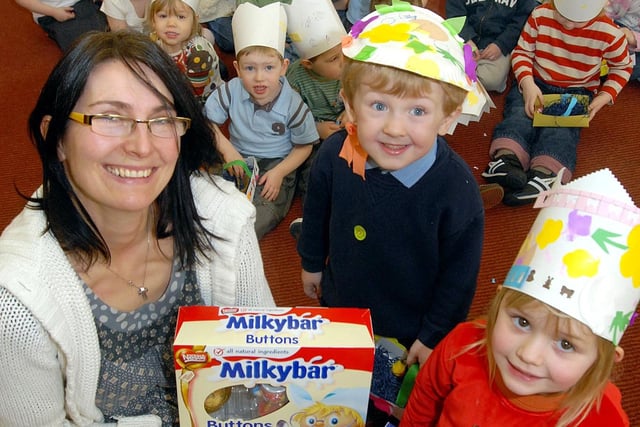 2008: Sally Newsome, children and family ministry assistant, presents Easter eggs to Easter bonnet competition winners at Hucknall Baptist Pre-school playgroup.