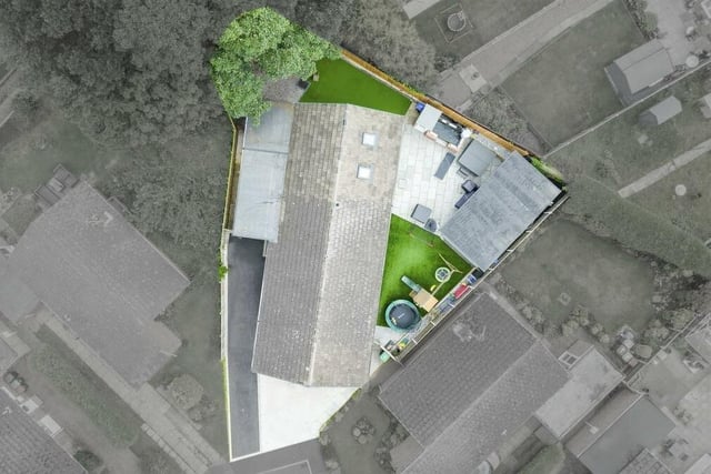 An aerial drone shot shows the triangular plot that houses the impressive £500,000 bungalow on Portland Park Close in Hucknall.