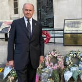Sir John Peace, Lord-Lieutenant of Nottinghamshire, with some of the tributes laid to the Queen in the county.