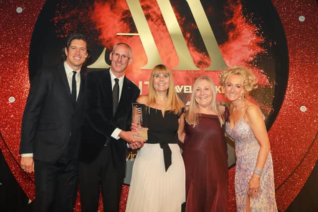 Members of the Your Co-op Travel team receive their award from event hosts Vernon Kay (left) and Lucy Huxley (right). Photo: Alex Maguire