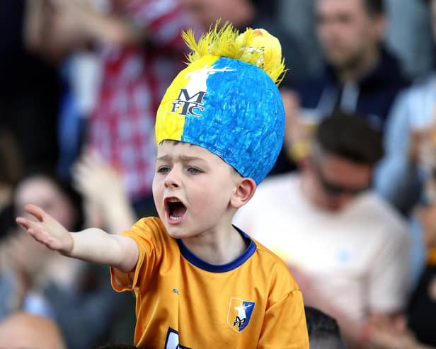 A youngster enjoys a Stags v Morecambe game.