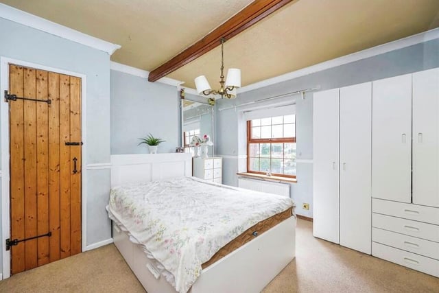 This beautiful bedroom, which also faces the front of the house, is blessed with wardrobe and storage space.