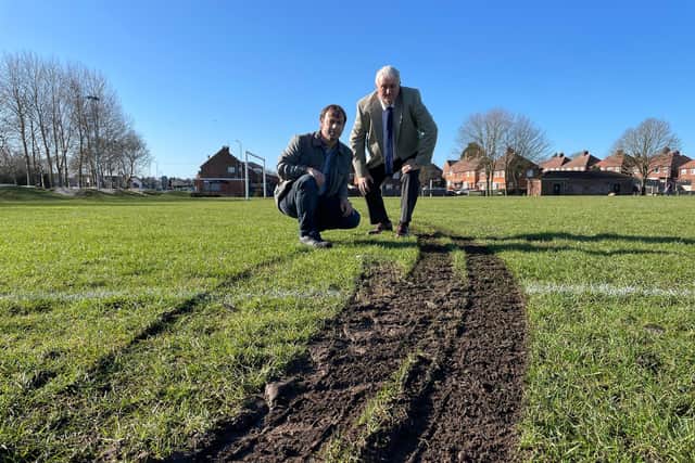 Councillors Lee Waters (left) and David Shaw inspect the damage left by off-road bikes on Nabbs Lane Park