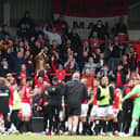 Morecambe fans celebrate their side's play-off semi-final victory overTranmere Rovers.