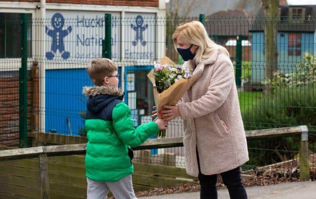 Diane Scotcher receives her flowers from her son at National Primary School in Hucknall