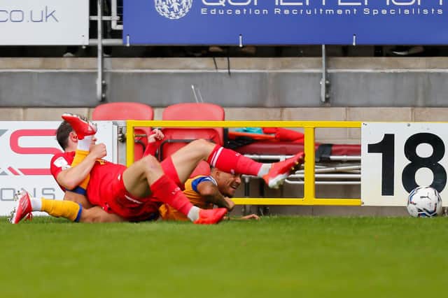 Tyrese Sinclair is brought down by Leyton Orient's Theo Archibald. Photo : Chris Holloway/The Bigger Picture.media