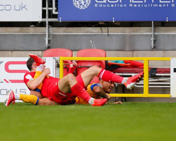 Tyrese Sinclair is brought down by Leyton Orient's Theo Archibald. Photo : Chris Holloway/The Bigger Picture.media