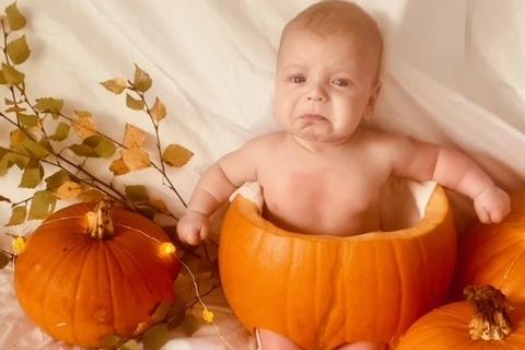 Jodie Buckley's little one is not sure they like being a Halloween pumpkin!