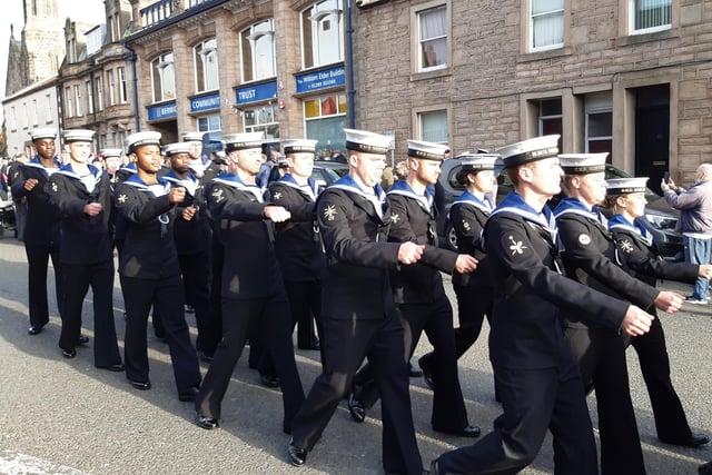 HMS Northumberland crew parade towards the town hall.
