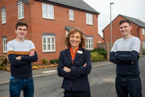Jane Bayliss with sons James and Rob who have both now moved into the same new development thanks to their mum's recommendation