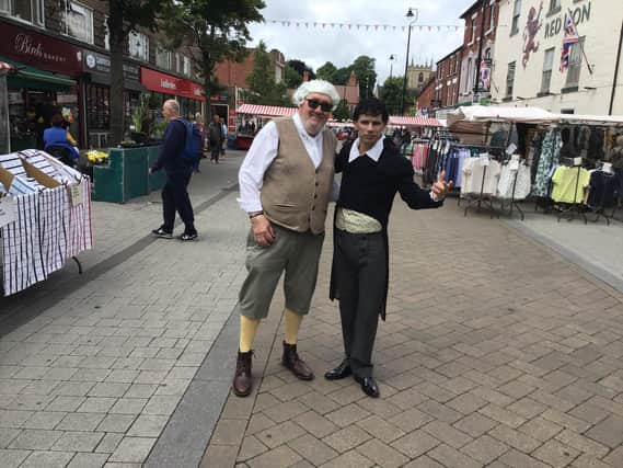 Jon Brown, as Lord Byron, and Byron Festival organiser Ken Robinson went on a walkabout in Hucknall on the opening day. Photo: John Wilmott