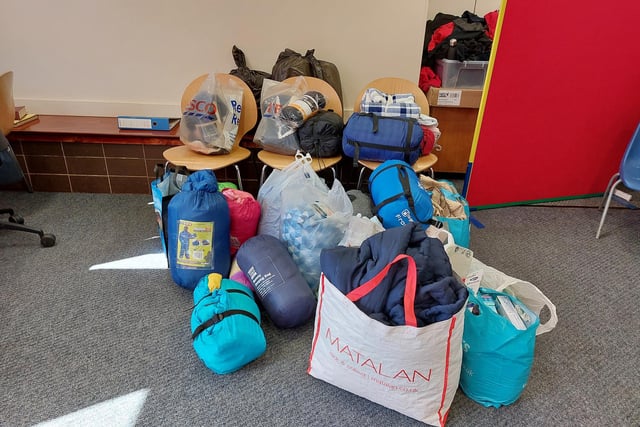A large pile of donated sleeping bags and blankets donated by families associated to Hucknall's Edgewood Primary School