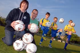 Hucknall's Rolls Royce junior football teams prepare for a marathon football event in aid of Clic Sargent in 2011. Pictured from the left are; Jo Hobbs, Under 9's Secretary, Mark Thorley U13's Assistant Manager and players Joshua Hobbs 9, Owen Hall 9 and 13 year old Tom Thorley.