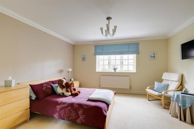 Three of the property's four bedrooms sit on the first floor, starting with this one. It has a carpeted floor, coving to the ceiling and a window overlooking the front of the house.