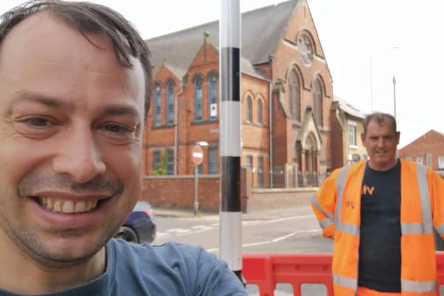Coun Lee Waters, with a Via road worker, has welcomed the improvement works on the crossing