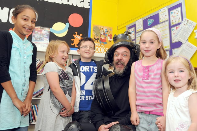 2010: Mr Beetle entertains youngsters Veera Kaur, Jessica Croft, Jacob Nyilasi, Hannah and Georgina Severn during a Bulwell Library event.