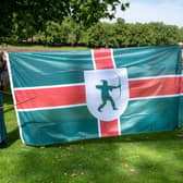Robin Hood and Maid Marian helped raise the flag for Nottinghamshire Day. Photo: Nottinghamshire Council