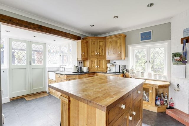 As well as windows, with stained glass inserts, in the kitchen, to the side and rear of the £425,000 house, there are double doors that lead out to the back garden.