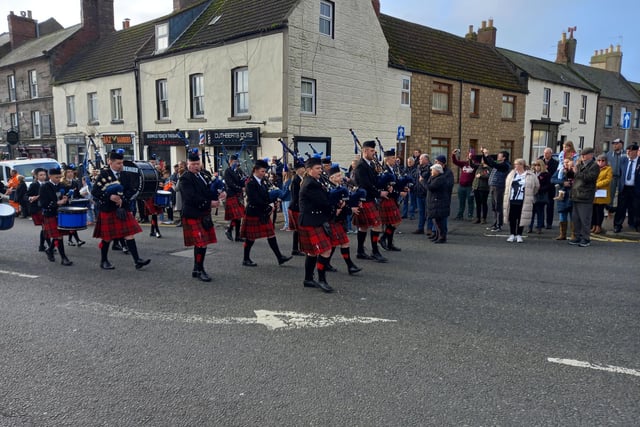 Berwick Pipe Band leading the parade to the war memorial.