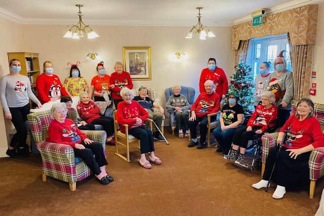 A colourful scene as Hall Park Care Home staff and residents took part in Christmas Jumper Day