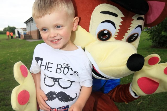 Charlie Titherley, three, meets a Paw Patrol character at a Fun Factor fun day held at the park
