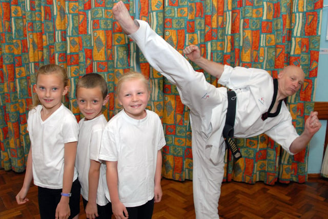 Pupils at Hucknall's Leen Mills Primary School take part in a martial arts workshop with members of the Kanghan Combat Academy. Pictured with Ian Lennox are pupils, from the left; Libby Faylor 8, Kyle Chambers 8 and Tegan Seagrave 7.