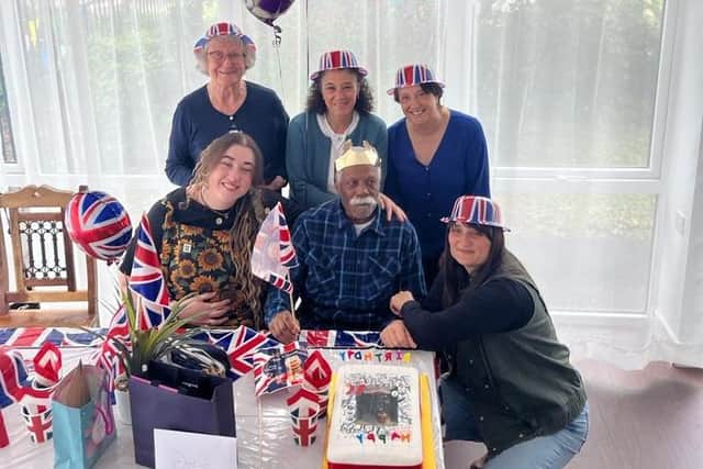Park House Care Home radiates joy as they celebrate a birthday amid a vibrant Coronation Street/VE Day party.