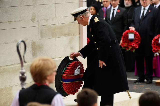 The Prince of Wales lays a wreath during the Remembrance Sunday service at the Cenotaph, in Whitehall, London. The Queen was absent from the ceremony due to her health. Picture date: Sunday November 14, 2021.