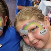 Youngsters remembering Kouper with colourful face painting