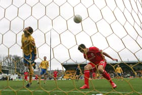 Jake Buxton of Mansfield Town heads the ball in to his own net under pressure from Stewart Downing of Middlesbrough to score an own goal during the FA Cup 4th round match on January 26, 2008 in Mansfield, England. (Photo by Alex Livesey/Getty Images)