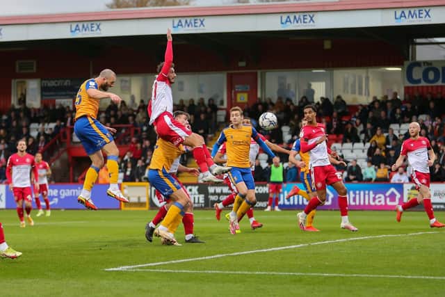 Mansfield Town midfielder John-Joe O'Toole heads the Stags into the lead at Stevenage on Saturday. Photo by Chris Holloway/The Bigger Picture.media