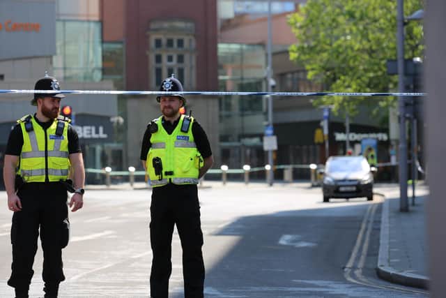A large police presence remains on the city streets and several roads remain closed