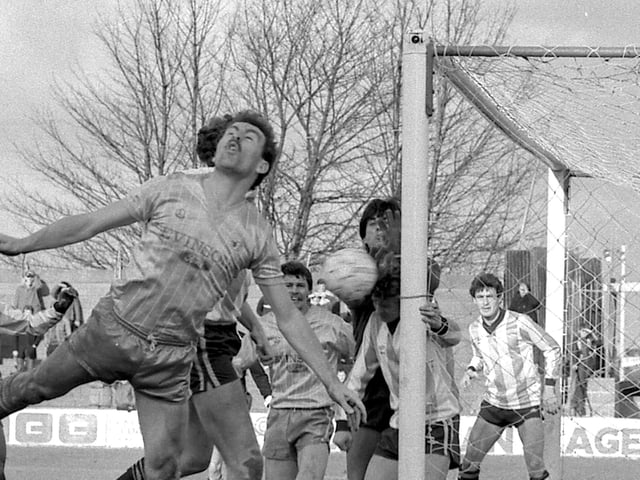Billy Eyre leaps for the ball against Reading.