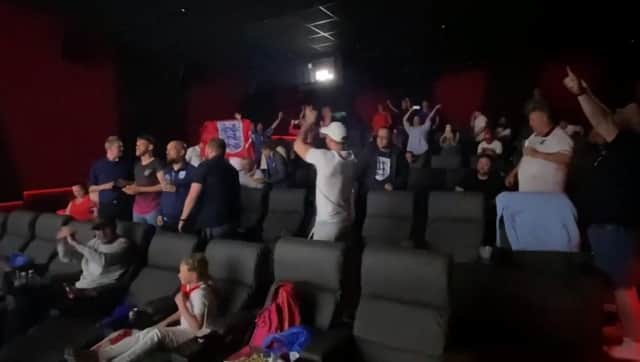England fans celebrate beating Germany after watching the game at the Arc Cinema
