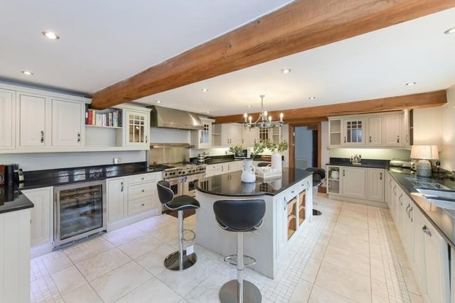 Let's move on now to the kitchen and breakfast room, which is newly fitted at the £1,250,000 Linby house. It has an island and granite worktops, and looks out to an internal courtyard.