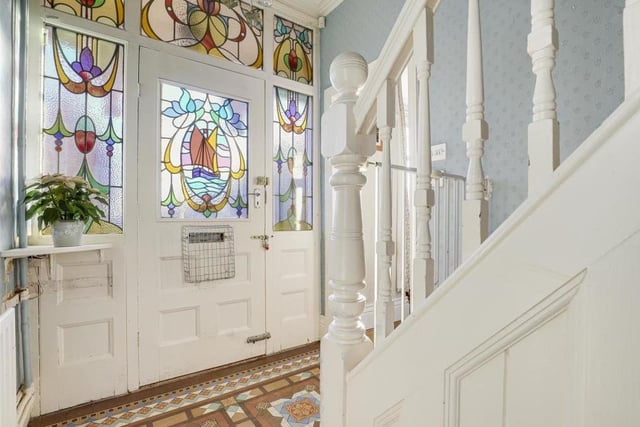 As you step inside the Sandy Lane property, note the ornate, stained glass inserts in the front door and the windows of the entrance hall. The patterned, tiled flooring in the hall also sets the tone for the traditional beauty of the house.