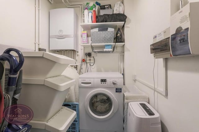 Just off the dining kitchen at the £475,000 house is this small but handy utility room. It contains a wall-mounted boiler, and there is space and plumbing for a washing machine.
