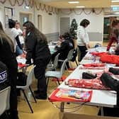 Bulwell police cadets helped wrapped presents for Bags of Blessings to hand to deprived children. Photo: Nottinghamshire Police