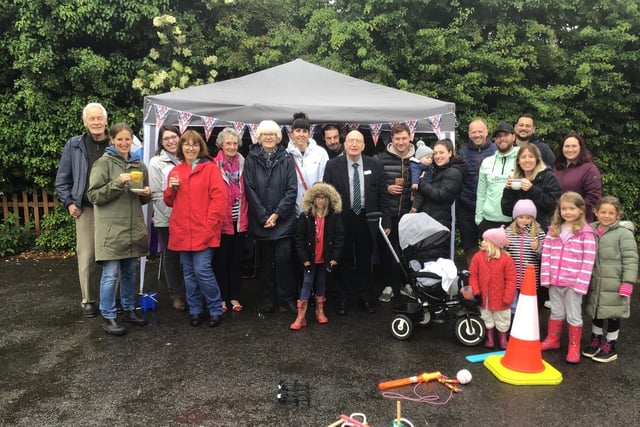 Residents of Leadale Avenue, off Papplewick Green, brave the rain to enjoy their party