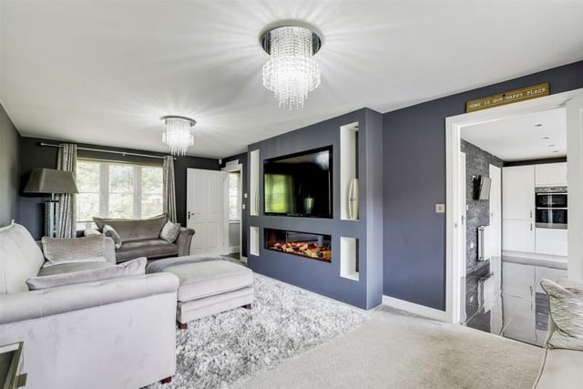 There's only one place to open our photo gallery -- and that's in the expansive family room, which runs the length of the £350,000 Hucknall home and includes an eyecatching feature fireplace. Windows face the front and rear, while the floor is carpeted.