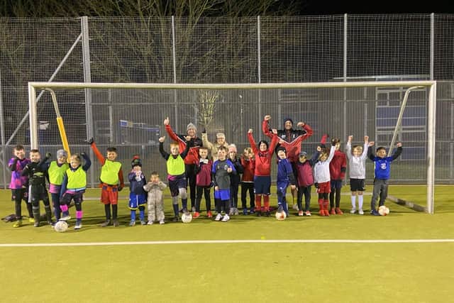 Members of Hucknall Sports Under-8s Whites training team raised more than £450 - which they shared with the food bank