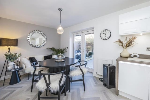 The kitchen at the £350,000 property includes this delightful dining area. Double-glazed French doors open out to the back garden.
