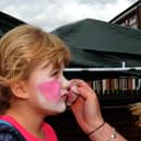 2010: Leah Louise Bradley has her face painted by Amanda Downes at a street party held by the Bulwell Forest Action Group.