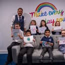 Head teacher Karl Clowery with children and their designs concerning courage and friendship inspired by Stephen Lawrence Day. Photo: Lou Brimble